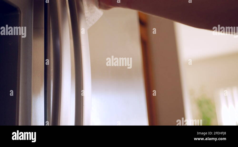 Cleaning and sanitizing a stainless steel kitchen refrigerator