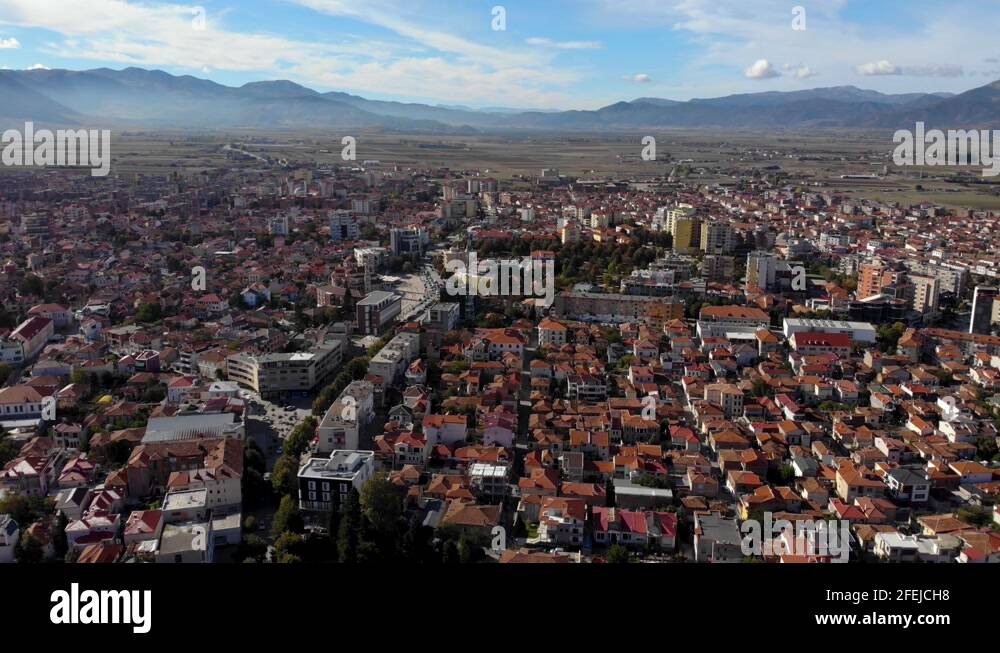 City of Korca in Albania with traditional houses covered in red roofs