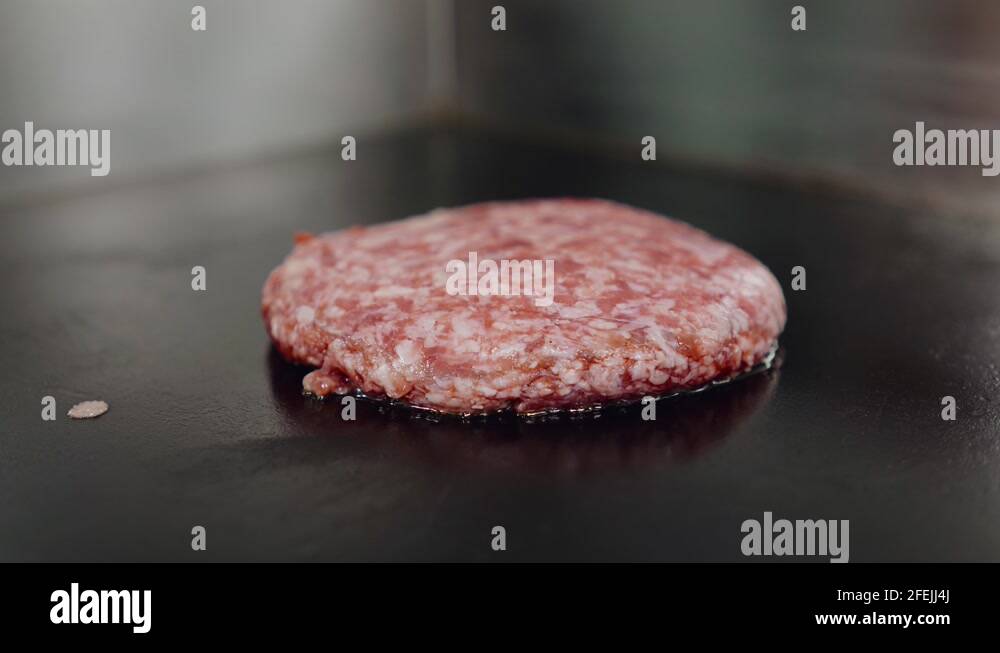 Shef Cooking beef and pork patty for burger. Meat roasted at kitchen