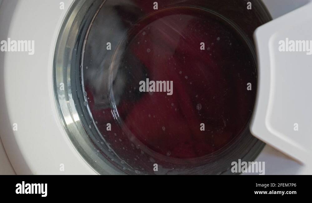 Static shot of washing machine spinning and washing clothes Stock Video