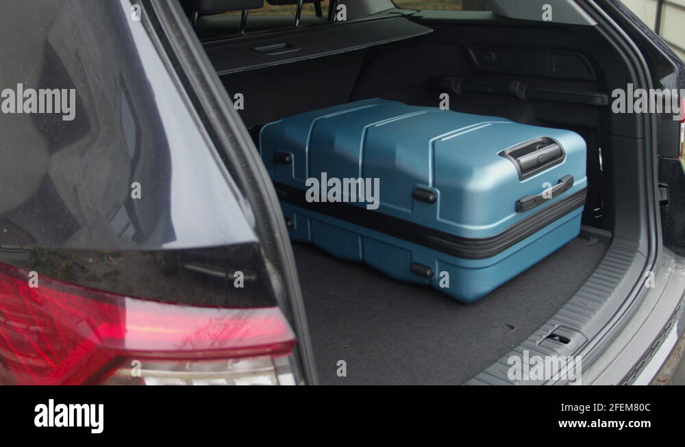 Man get all the travel bags in the trunk of his car Stock Video Footage