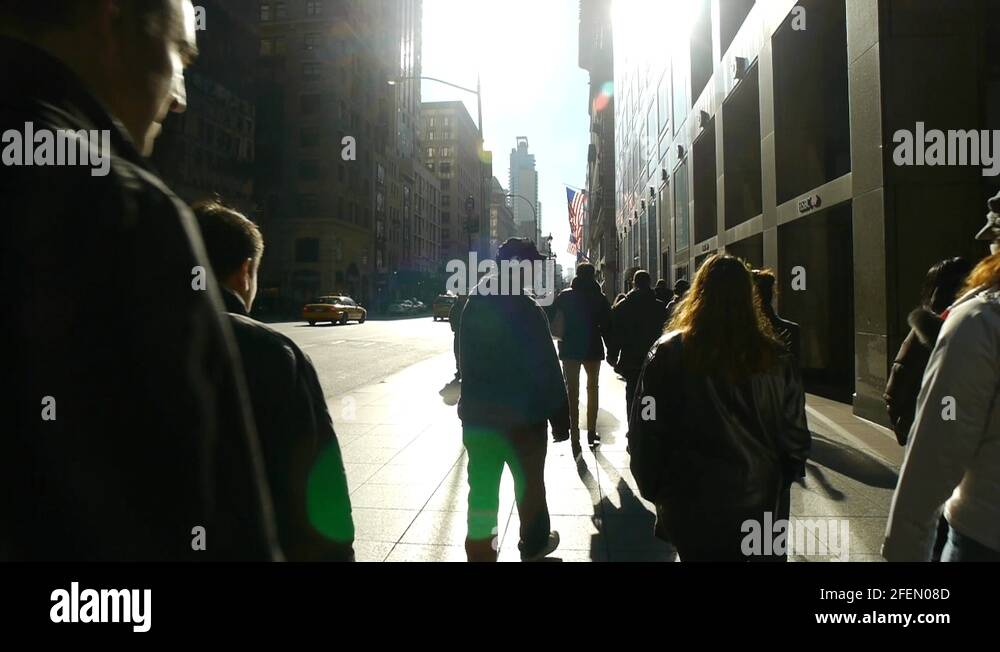 Crowd of people walking backlight in New York City slow motion Stock ...