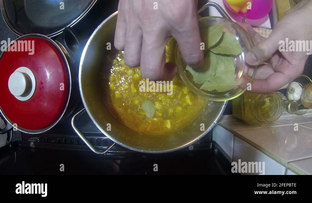 Chef Adding Bay Leaf To Chicken Stew Stock Video Footage Alamy
