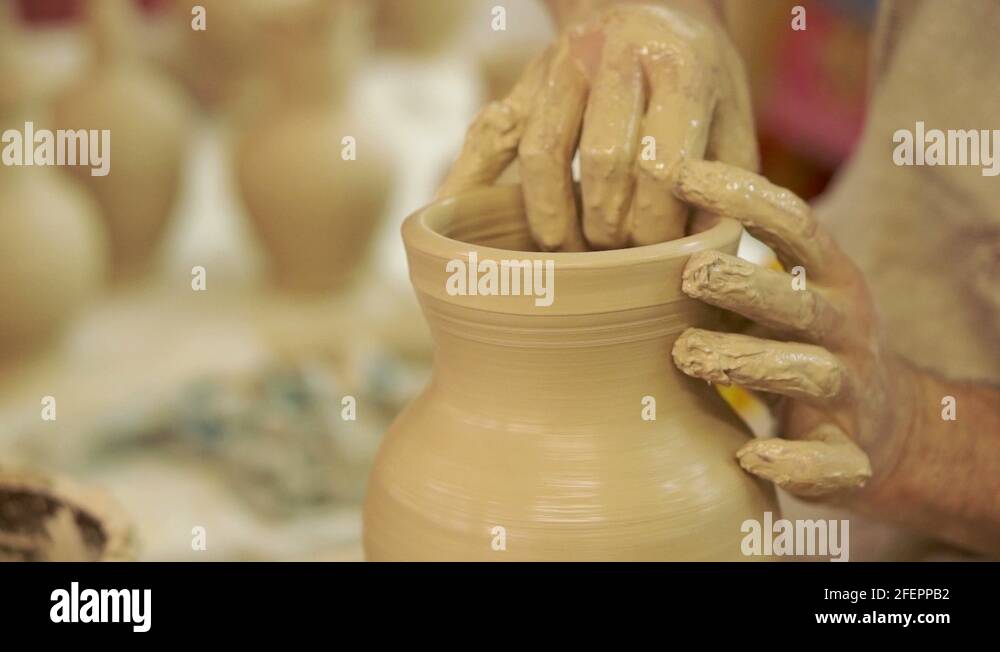 Potter works. Crockery creation process in pottery on potters' wheel