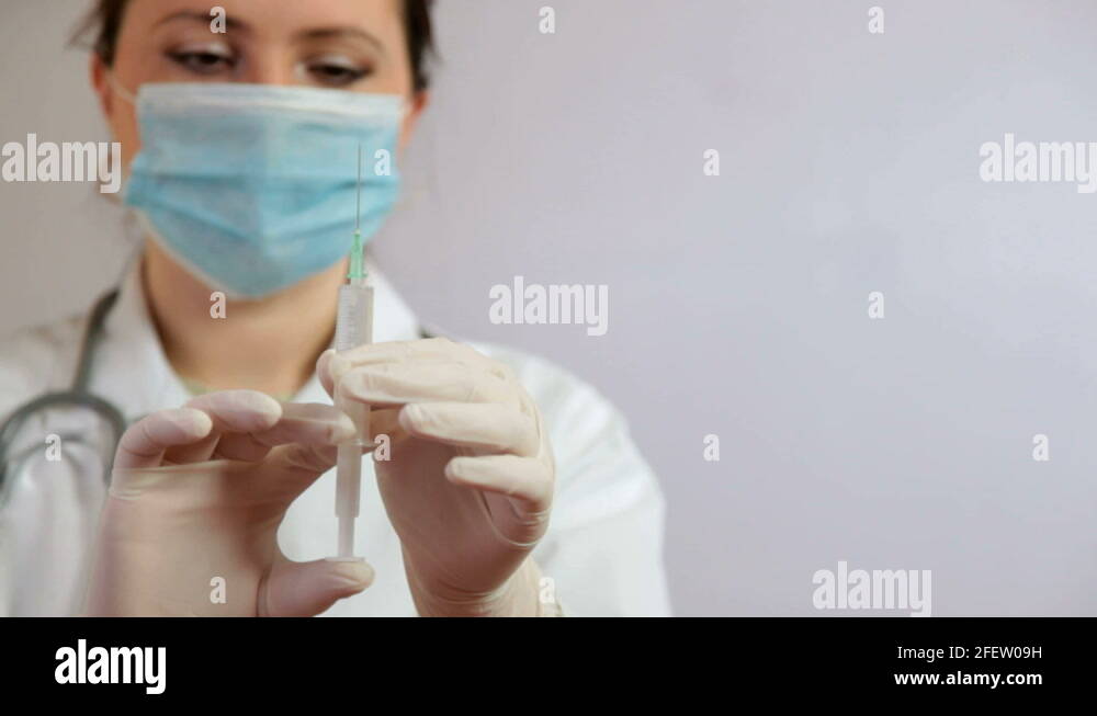 Nurse using syringe Stock Video Footage Alamy