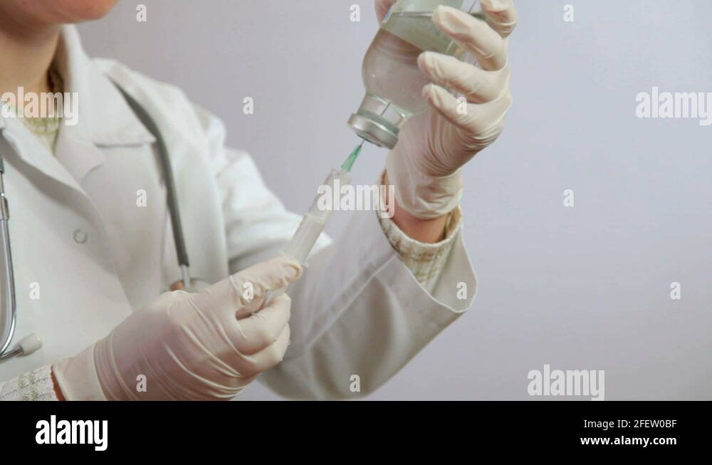 Nurse using syringe Stock Video Footage Alamy