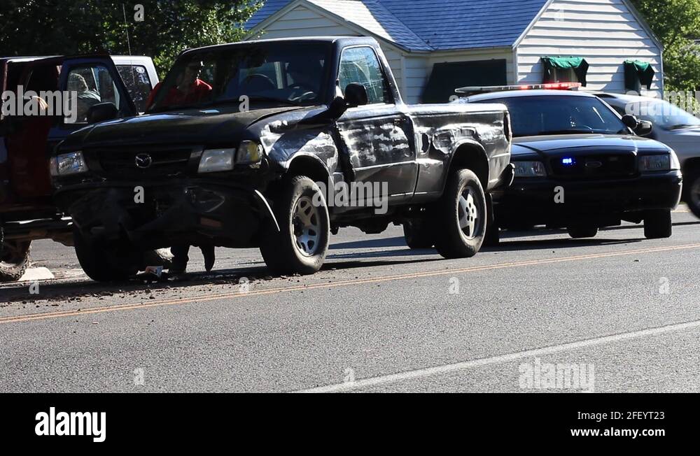 POLICE CAR WITH FLASHING LIGHTS AT SCENE OF ACCIDENT Stock Video