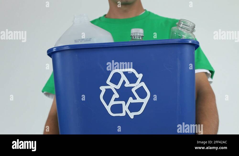 Putting plastic bottle in recycle bin Stock Video Footage Alamy