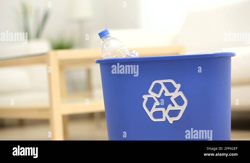 Putting plastic bottles in recycle bin Stock Video Footage Alamy