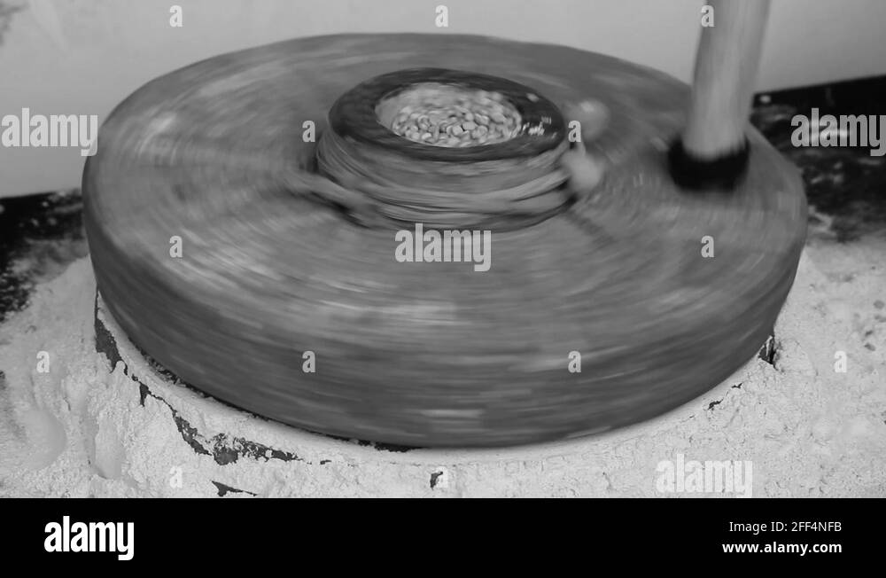 Closeup of a traditional stone grinder, India Stock Video Footage Alamy