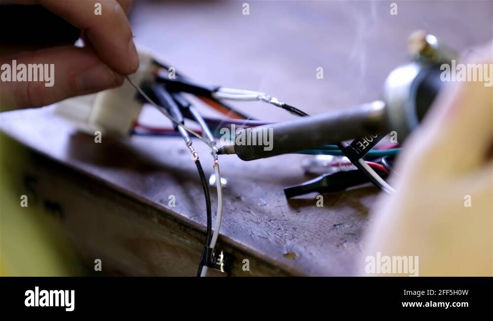 Soldering wires on car radio module Stock Video Footage Alamy