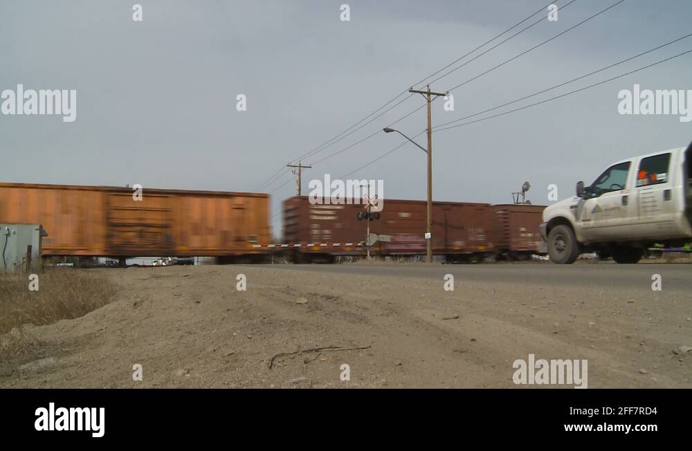 railroad, freight train, level crossing, pick up truck arrives Stock