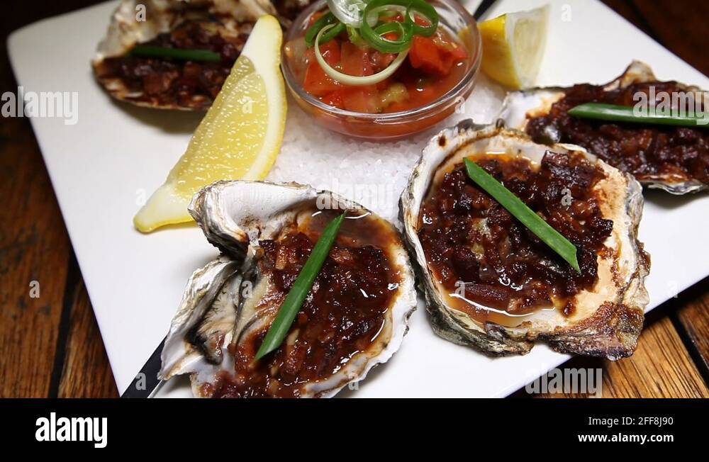 Oysters kilpatrick Stock Videos & Footage HD and 4K Video Clips Alamy