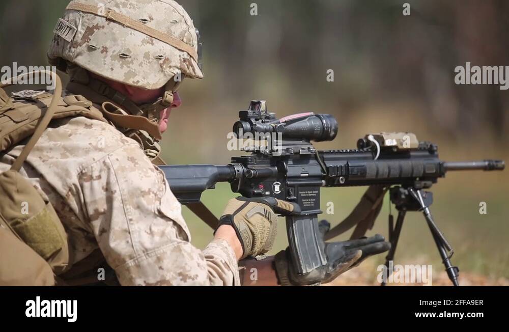 US Army soldier aims his weapon at firing range in joint training ...