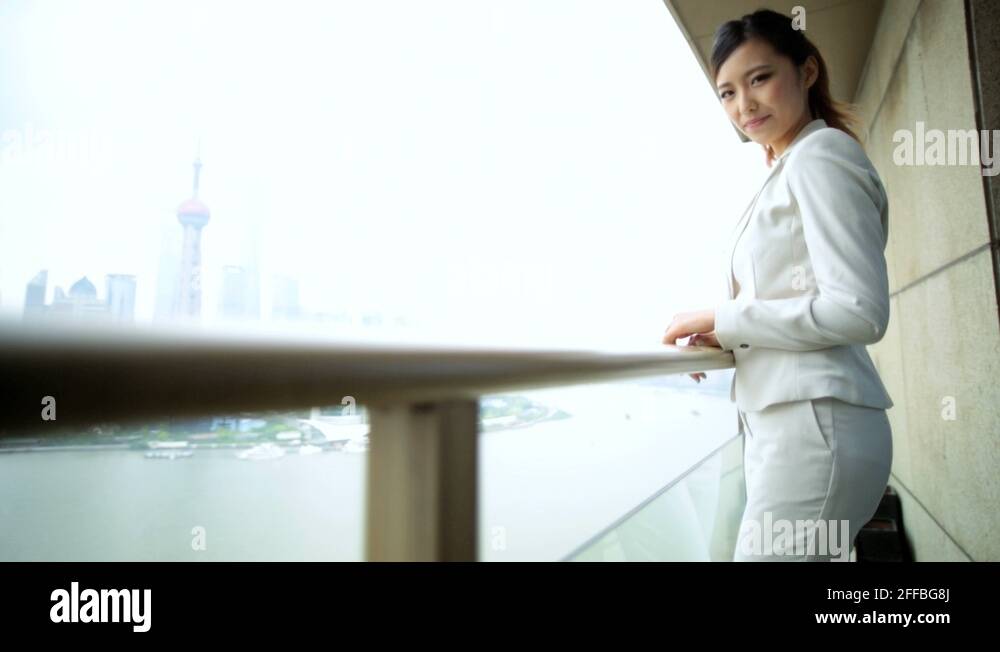 Curated visual reference: Visual Reference: Female Asian Chinese Business Traveller Luxury Penthouse Balcony