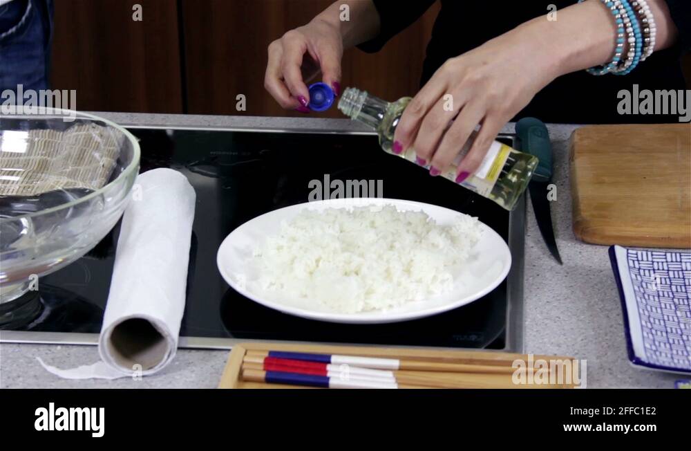 Adding Japanese Vinegar on Sushi Rice Stock Video Footage Alamy