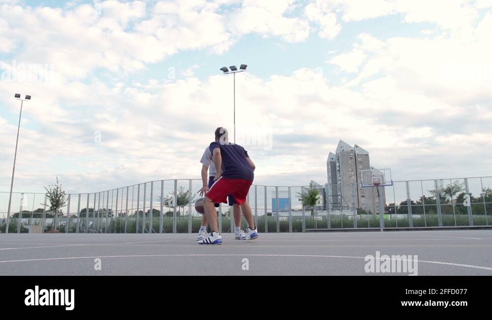 SlowMo Basketball Player Scores A Basket By A Slam Dunk Stock Video
