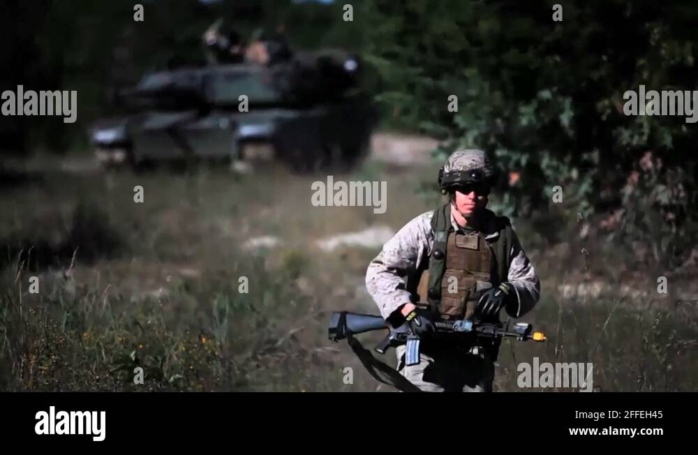 U.S. Marines conduct Tank Maneuvers - Marine running away from Tank ...