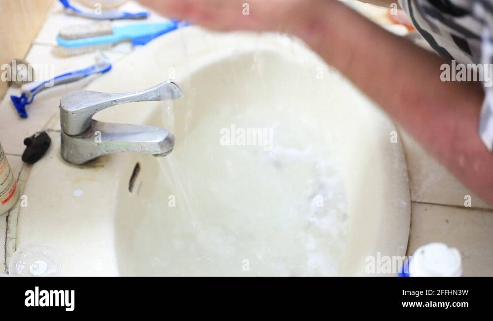 Man washing face in sink. HD. 1920x1080 Stock Video Footage Alamy