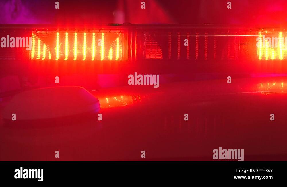 Intense red and blue emergency vehicle flashing lights at incident