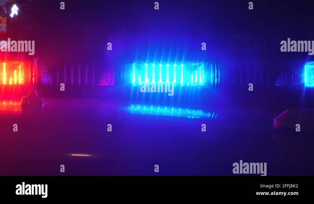 Intense red and blue emergency vehicle flashing lights at incident