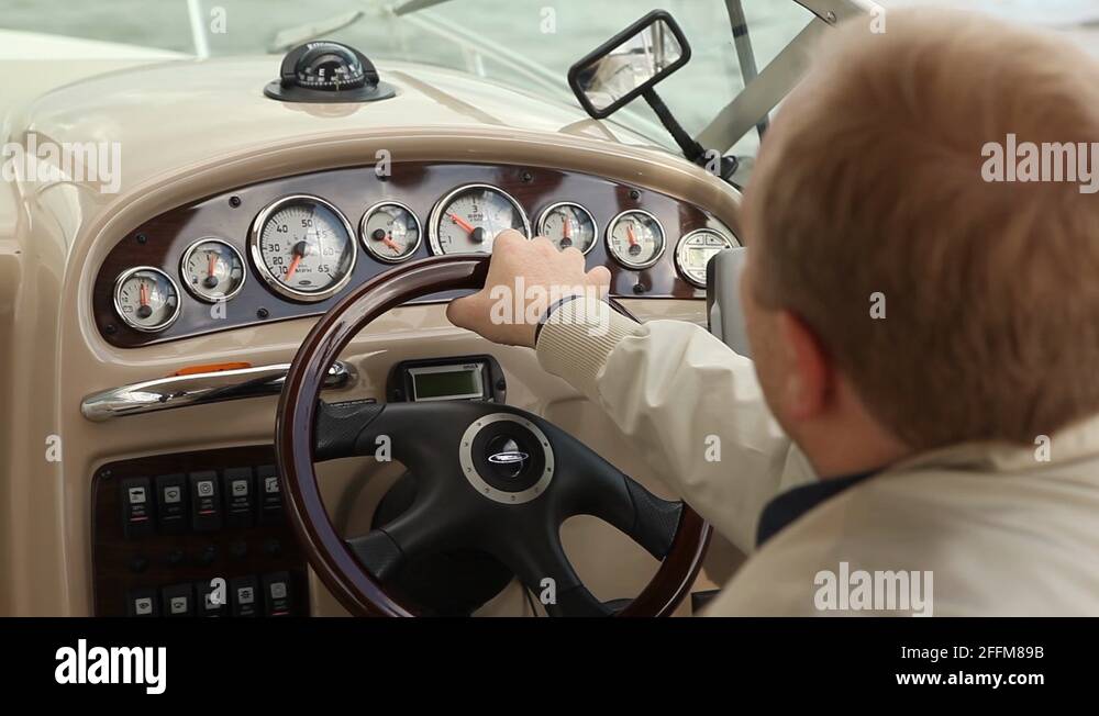 Man driving a boat Stock Videos & Footage - HD and 4K Video Clips - Alamy
