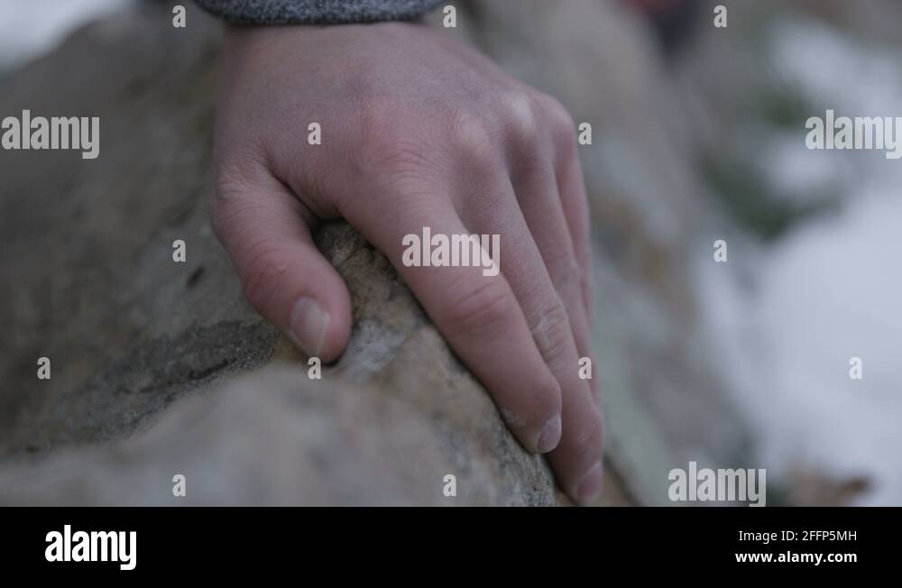 A young woman grips the rock on her climb Stock Video Footage Alamy
