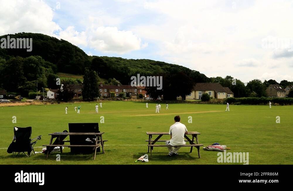 Cotswolds England Village Cricket green players team Stock