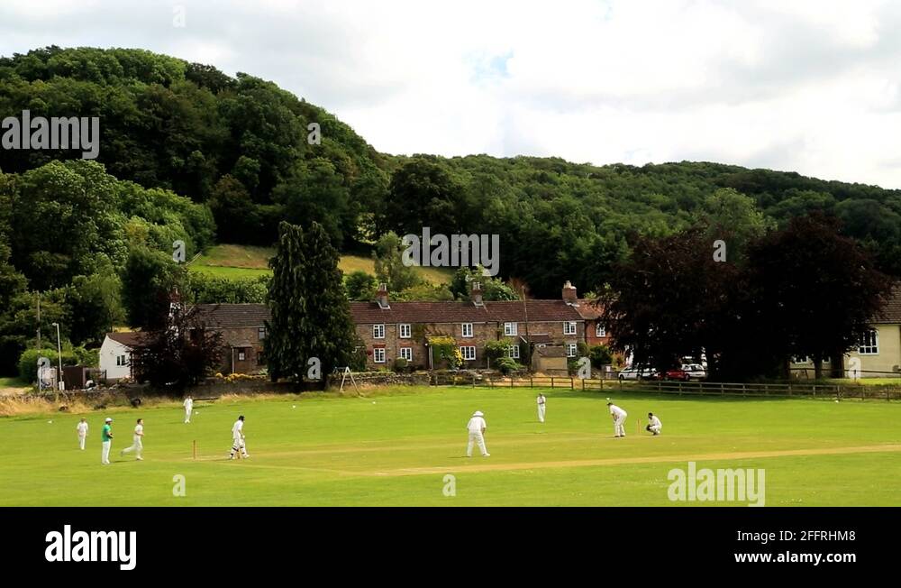 Cotswolds England Village Cricket green players team Stock