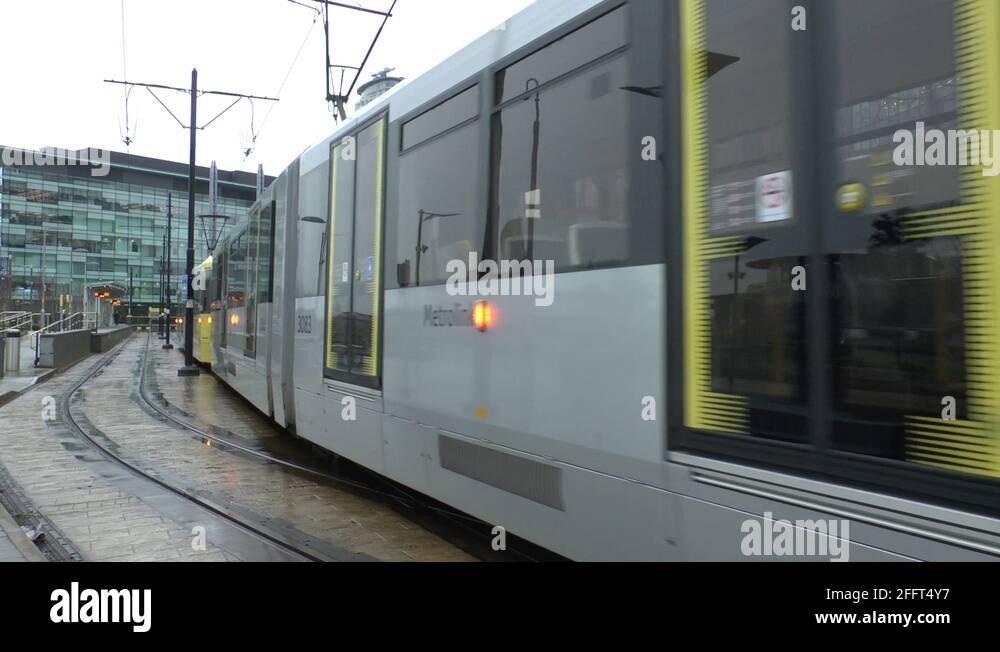 A Manchester Metrolink tram departing the station at MediaCityUK ...