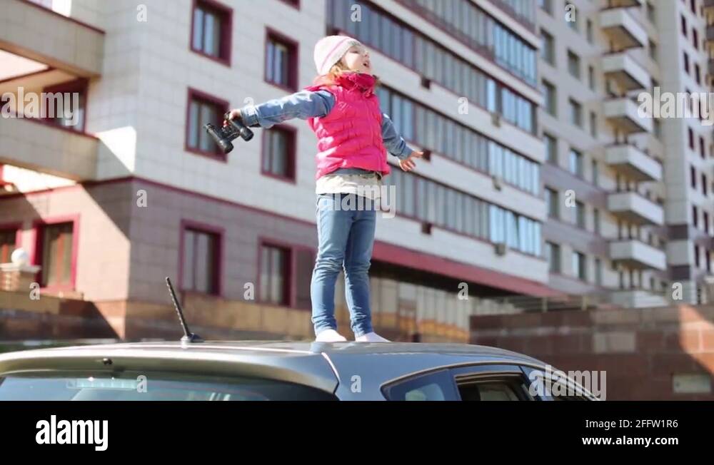 Girl on car roof Stock Videos & Footage - HD and 4K Video Clips - Alamy