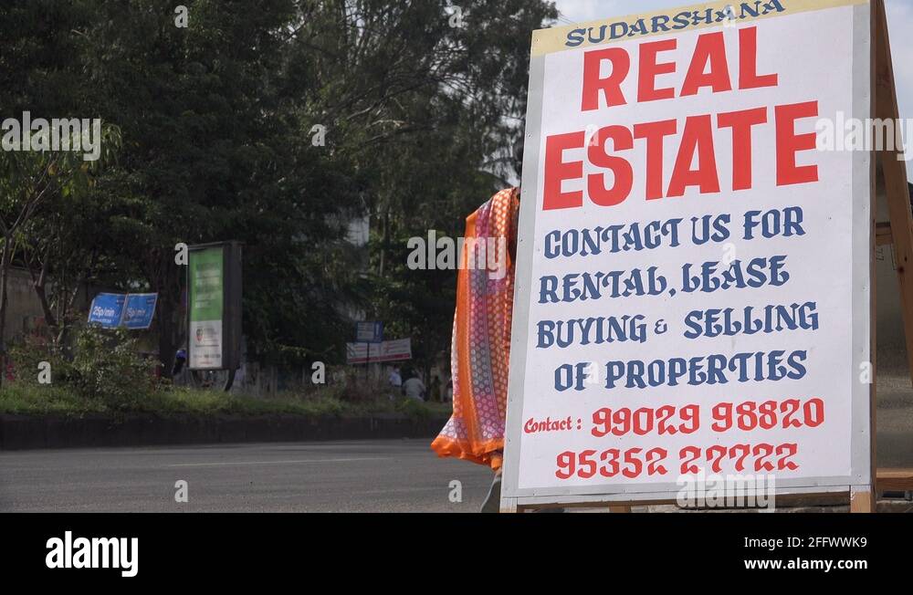 Real estate agent advertising billboard on streets of Bangalore in