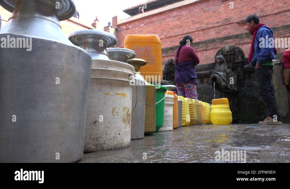 Water shortage buckets jerrycans queue fountain Kathmandu Nepal Asia