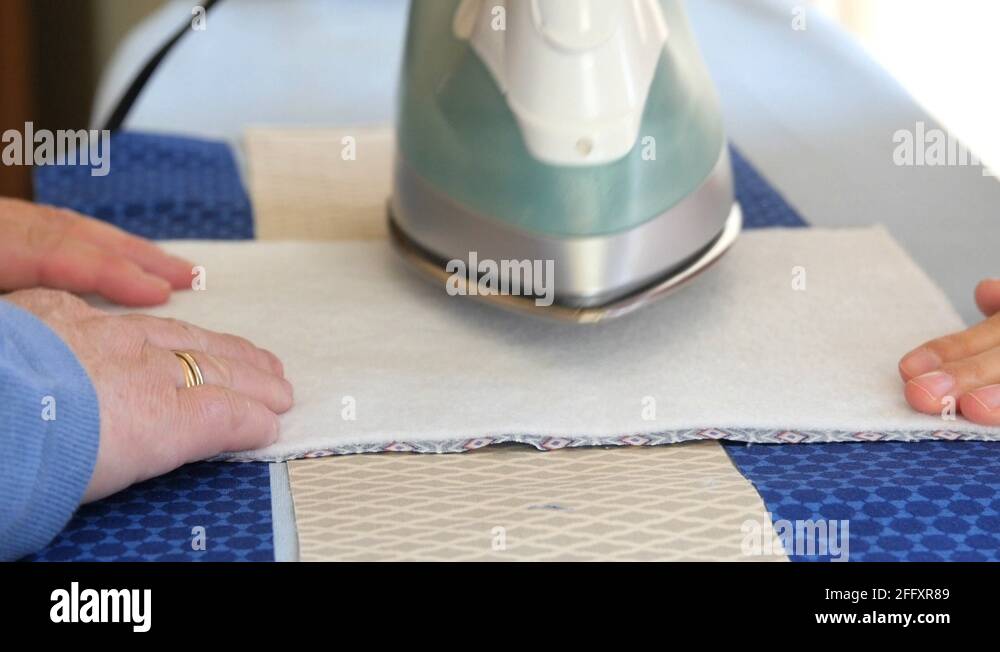 Women ironing sewing projects Stock Video Footage Alamy