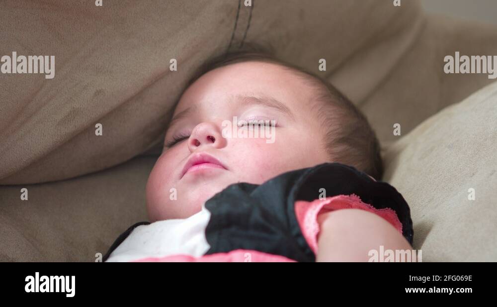 Baby girl sleeping on couch 4k Stock Video Footage Alamy
