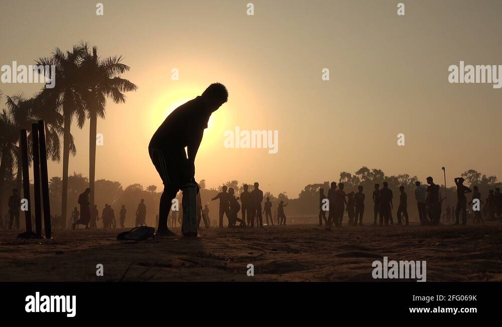 Young men play cricket at sunset in a park in Dhaka, Bangladesh Stock ...