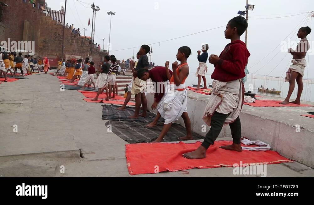 Indian boys practicing martial arts at dock of Ganges in Varanasi Stock