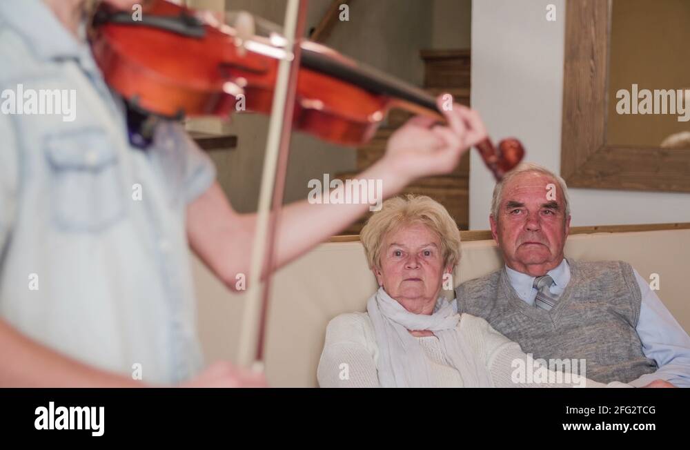 Grandparents watching talented boy playing violin 4K Stock Video