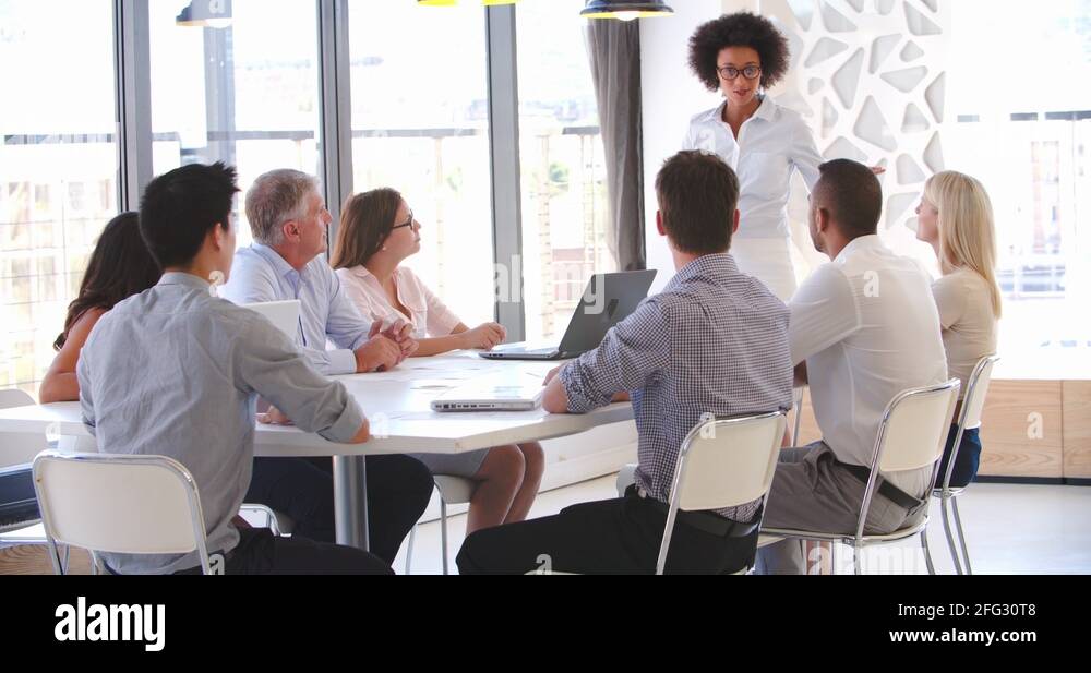 People Attending Business Meeting In Modern Open Plan Office Stock ...