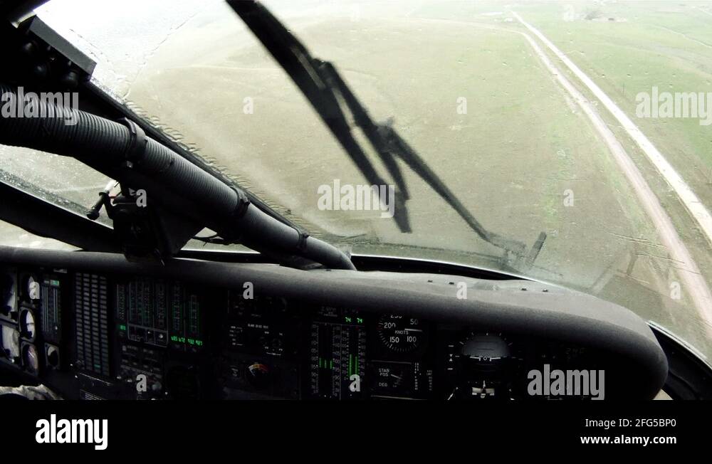 Point of view from Black Hawk copilot flying w/ windshield wipers