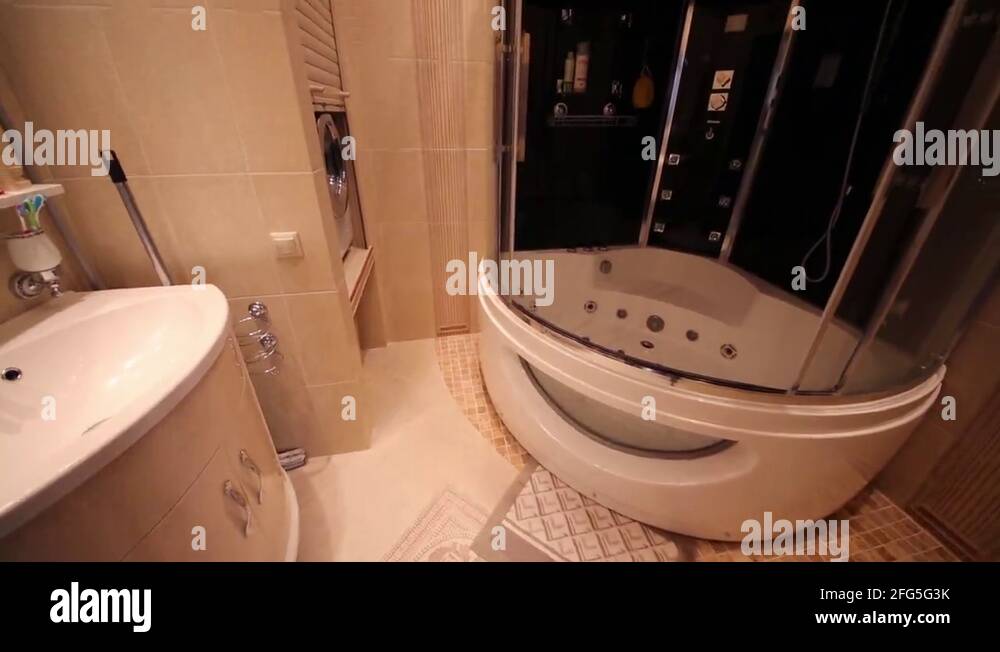 Empty bathroom in Greek style with modern shower cabin Stock Video