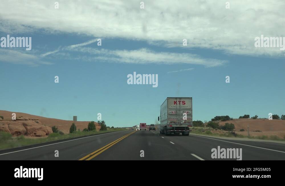 Busy desert road trucks POV through window 4K Stock Video Footage Alamy