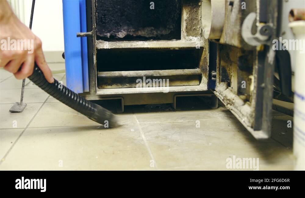 Vacuum cleaning ashes around furnace 4K Stock Video Footage Alamy