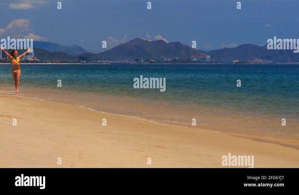 Blonde Slim Girl In Bikini Makes Shoulder Circle On Sand Beach Stock Video Footage Alamy 1879