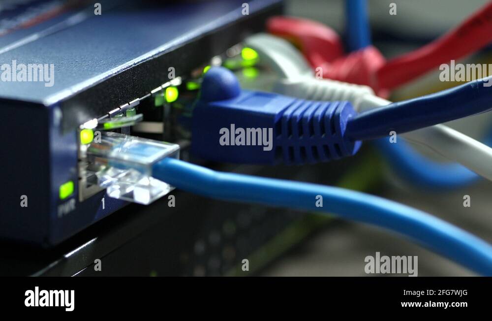 cable being plugged into router, close up Stock Video Footage