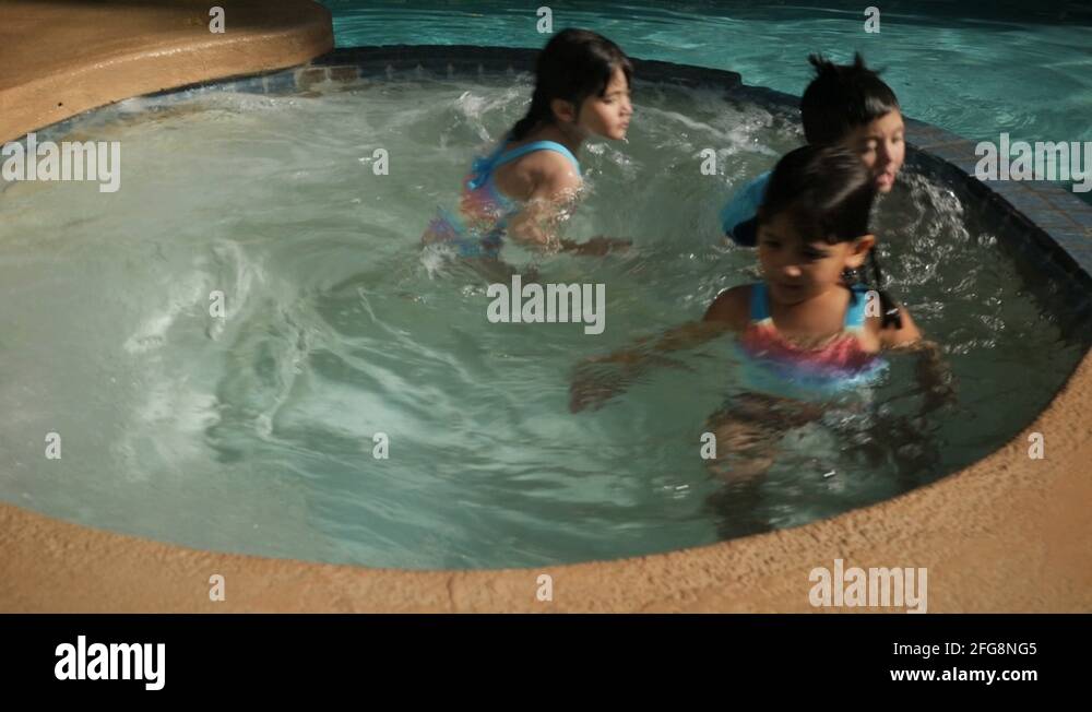 KIDS PLAY IN A JACUZZI IN SLOW MOTION Stock Video Footage Alamy
