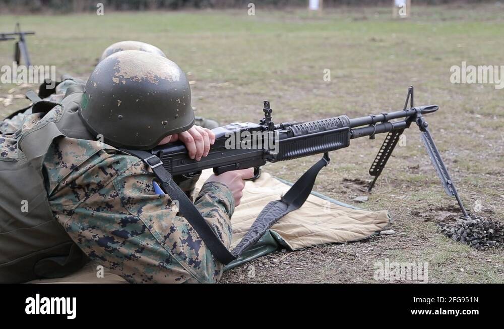 Bosnian Soldier shoot a machine gun at the polygon Stock Video Footage