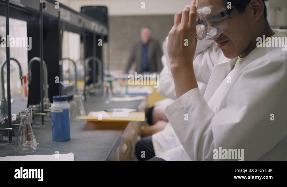 Students putting on their goggles and starting their science ...