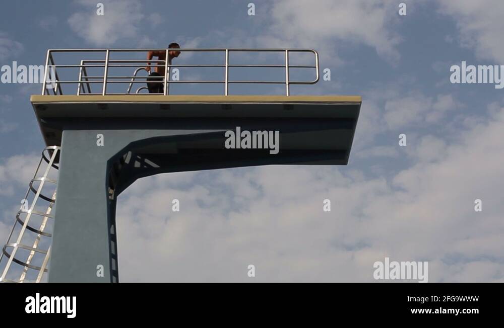 Man jumps from very high diving board, lands on stomach, painful pool