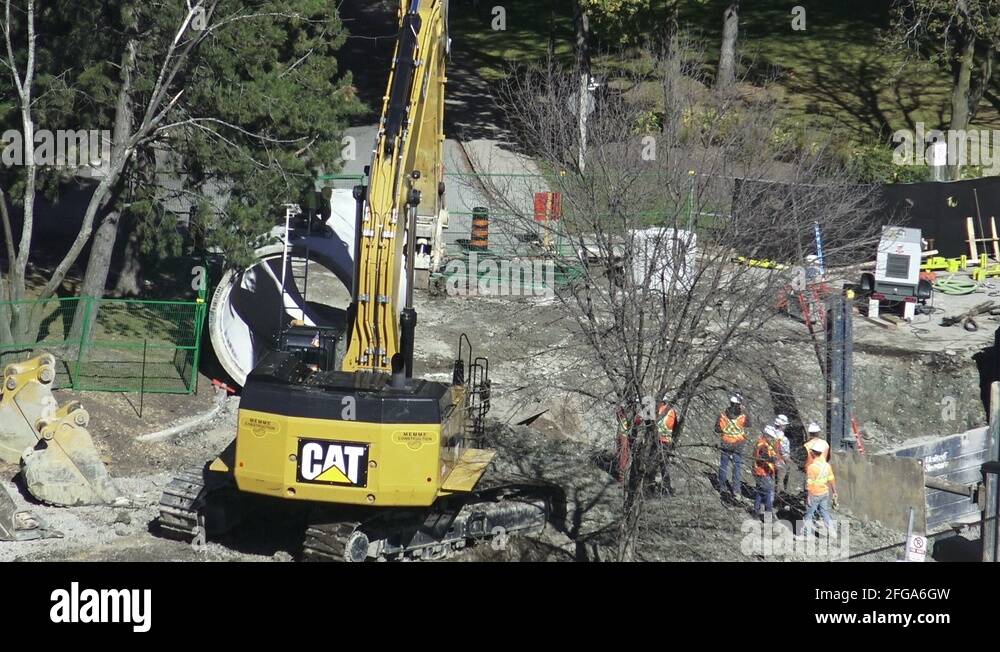 An Excavator Changing Buckets Stock Video Footage Alamy